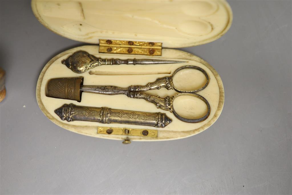 A Tunbridgeware pin cushion and an ivory cased manicure set